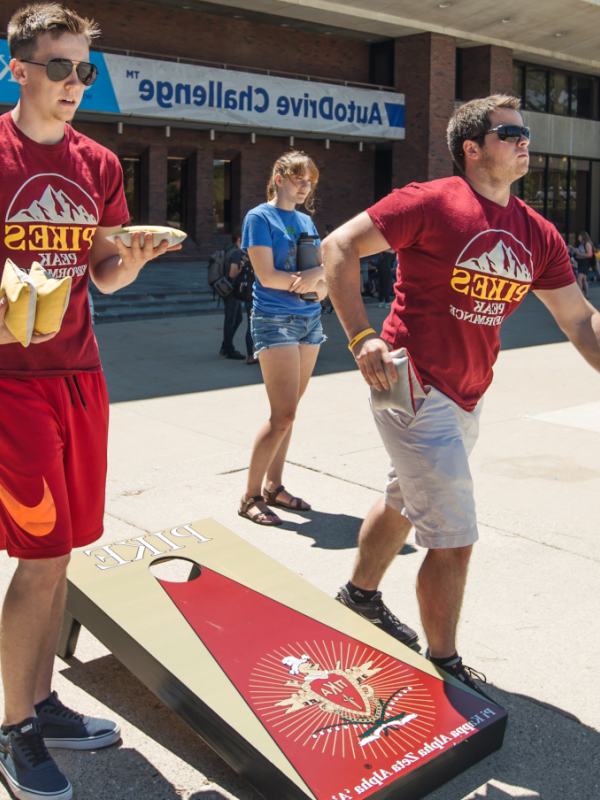 Pikes fraternity members play cornhole during Rush Week activities.